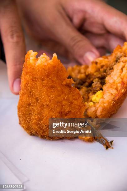 slicing a sicilian arancino - modica sicily stock pictures, royalty-free photos & images