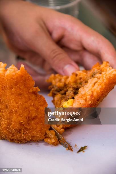 slicing a sicilian arancino - modica sicily stock pictures, royalty-free photos & images