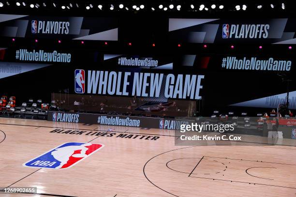 An empty court and bench is shown with the #WholeNewGame signage following the scheduled start time in Game Five of the Eastern Conference First...