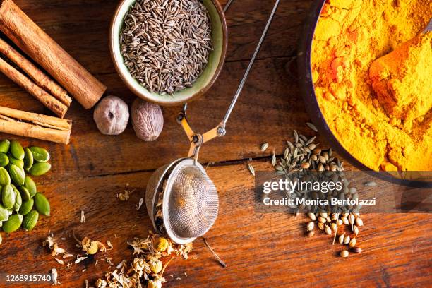colourful spices on wooden table - anti inflammatory stock pictures, royalty-free photos & images