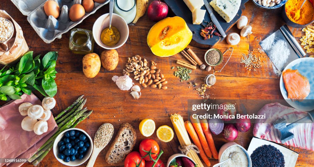 Various types of food on wooden table