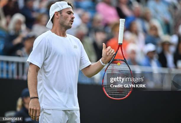 Player Tommy Paul plays with his racket during his men's singles quarter-final tennis match against US player Jeffrey John Wolf at the Rothesay...