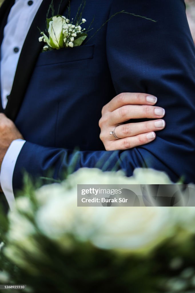 Solitaire Ring and Bridal Bouquet, Groom Suit and Wedding Dress, Bride Entering The Groom's Arm