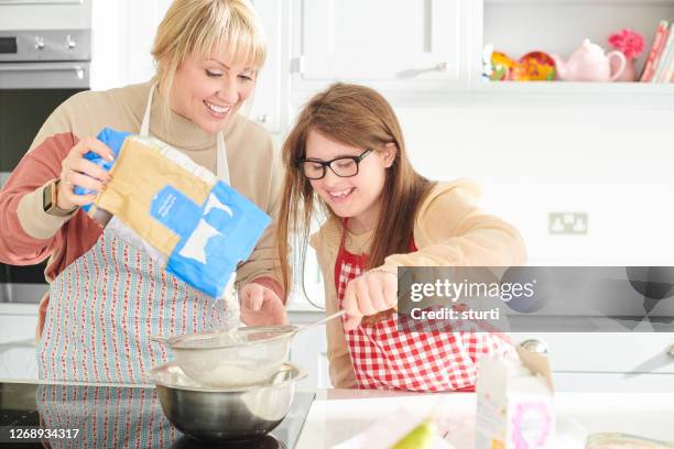 baking with mum - down syndrome cooking stock pictures, royalty-free photos & images