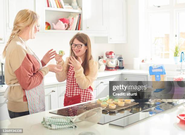 tasting session for mum - down syndrome cooking stock pictures, royalty-free photos & images