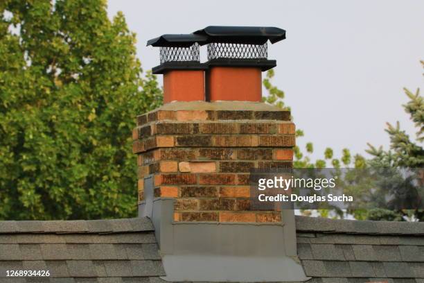 exhaust chimney with weather cover - schornstein stock-fotos und bilder