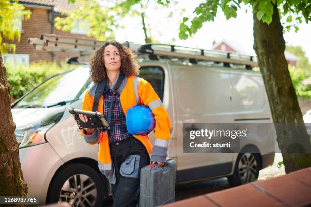 female electrician arrives at job - plumber van stock pictures, royalty-free photos & images