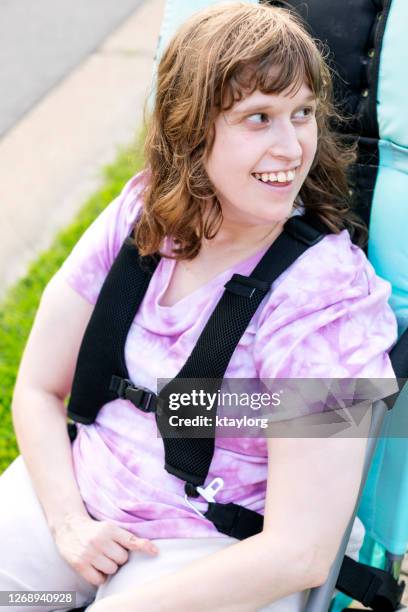 closeup of happy, intellectually disabled young adult - autism adult stock pictures, royalty-free photos & images