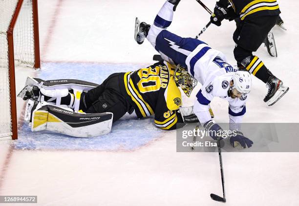 Barclay Goodrow of the Tampa Bay Lightning gets tripped up by Dan Vladar of the Boston Bruins during the second period in Game Three of the Eastern...