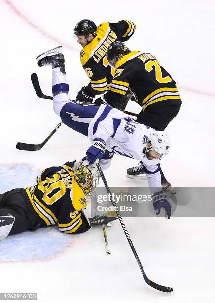 Barclay Goodrow of the Tampa Bay Lightning gets tripped up by Dan Vladar of the Boston Bruins during the second period in Game Three of the Eastern...