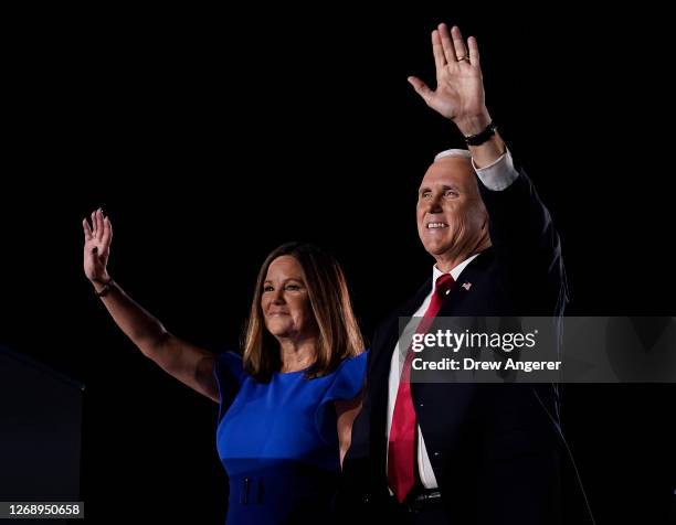 Mike Pence stands with his wife Karen Pence before accepting the vice presidential nomination during the Republican National Convention from Fort...