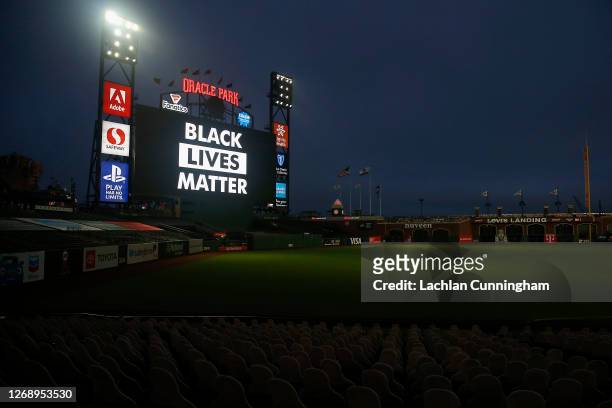 The words 'Black Lives Matter' are displayed on the digital screen after the postponement of the game between the San Francisco Giants and the Los...