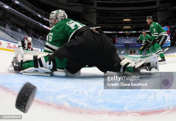 Goaltender Anton Khudobin of the Dallas Stars can't make the save on the one-timer shot for a goal by Mikko Rantanen of the Colorado Avalanche to tie...