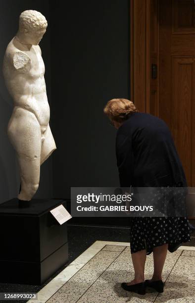 Visitor looks at a marble statue of a Roman Athlete, 75-100 AD, at the Getty Villa Museum in Malibu, California, 12 October 2006. The Getty Villa...