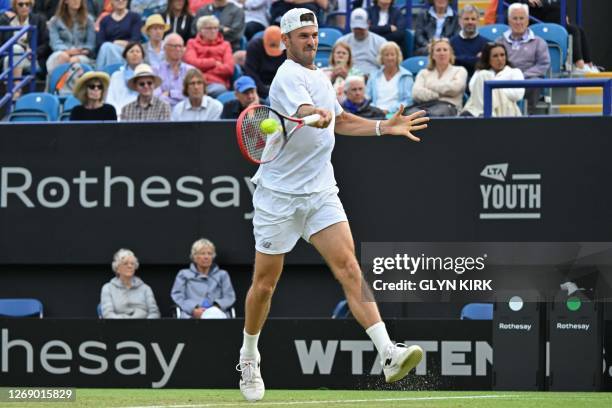 Player Tommy Paul returns to US player Jeffrey John Wolf during their men's singles quarter-final tennis match at the Rothesay Eastbourne...