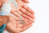 close up algohol gel on hand for cleaning , new normal lifestyle hand cleaning by algohol ge
