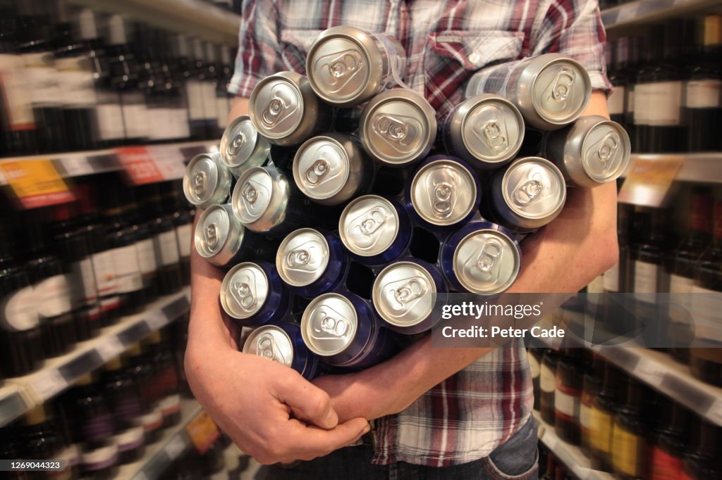 Multiple Cans Young Male Holding Multiple Beer Cans In Off Licence High-Res Stock ...