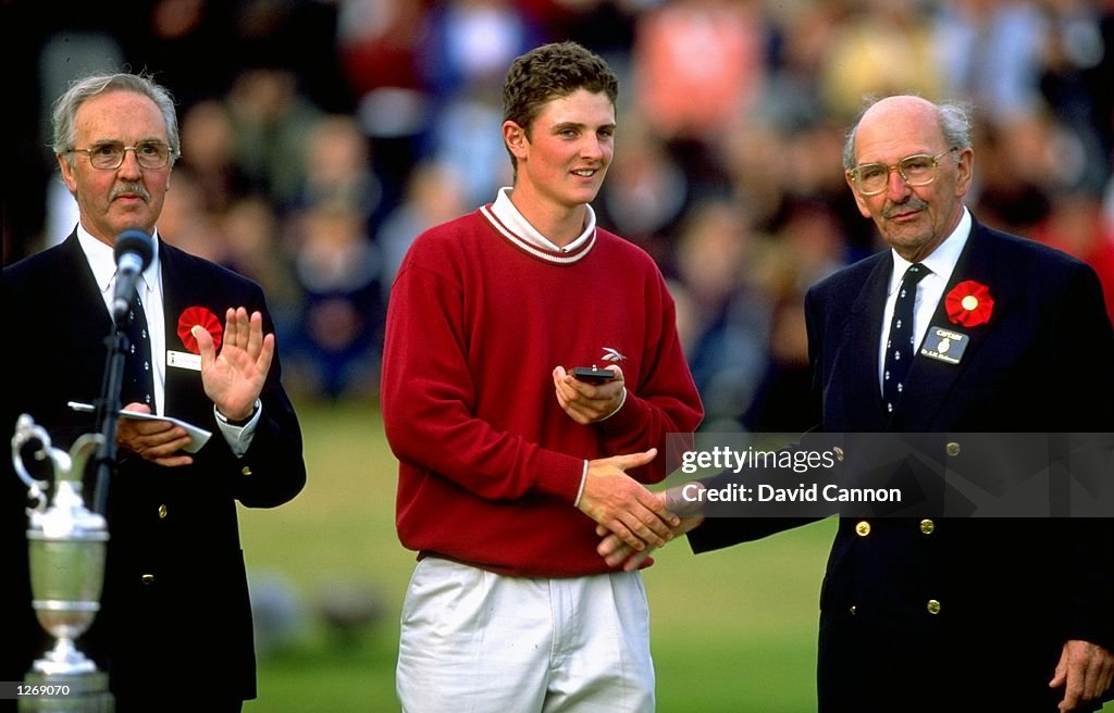 Leading amateur Justin Rose of England receives the silver medal ...