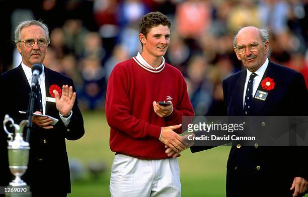 Leading amateur Justin Rose of England receives the silver medal after the British Open at Royal Birkdale Golf Club in Lancashire, England. \...