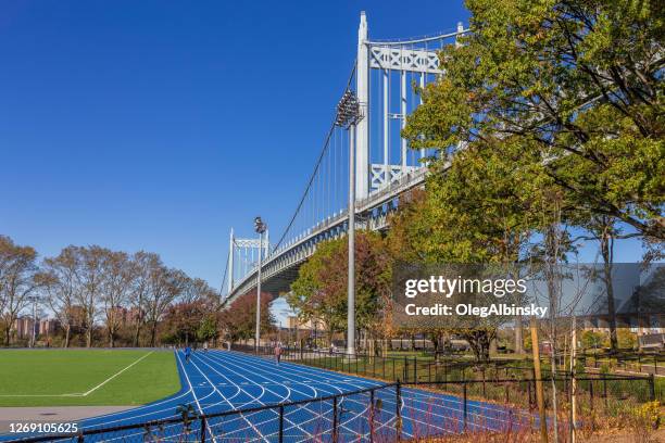 track and field complex and rfk triborough bridge, new york, usa. - east harlem stock pictures, royalty-free photos & images