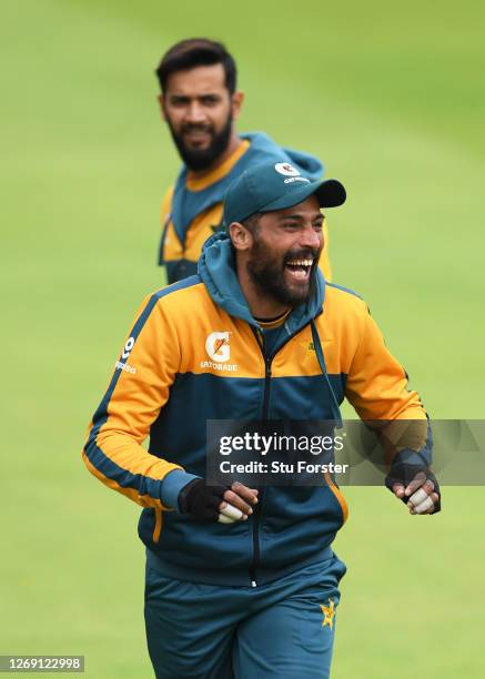 Mohammad Amir of Pakistan shares a joke during a Pakistan Net Session at Emirates Old Trafford on August 27, 2020 in Manchester, England.