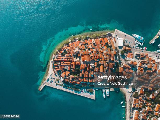 top aerial view of an old seaside town korcula in croatia, surrounded by clear blue waters - korcula island stock pictures, royalty-free photos & images