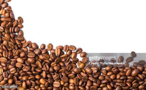 brown roasted coffee beans isolated on white background. food background. - coffee white background stock pictures, royalty-free photos & images