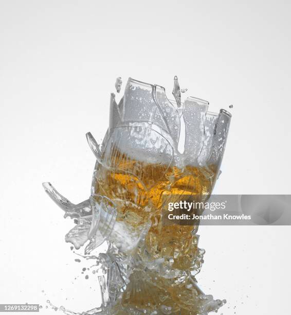 beer glass shattering - pint glass stock pictures, royalty-free photos & images