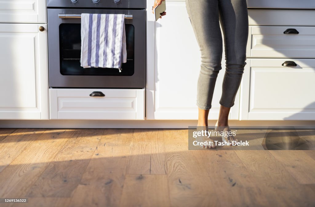 Slim Female Dancing At The Countertop