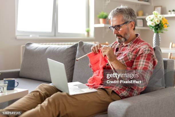 watching online tutorial - man knitting stock pictures, royalty-free photos & images