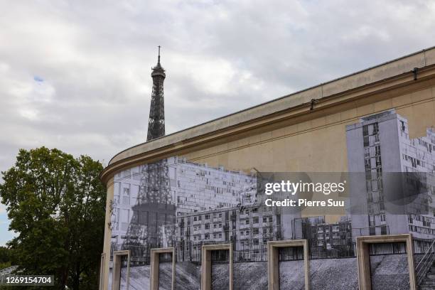 General view of a stencil by artist "JR" on the wall of the Palais de Tokyo the "Jusqu'Ici Tout Va Bien - Workshop De L'Ecole Kourtrajme" :...