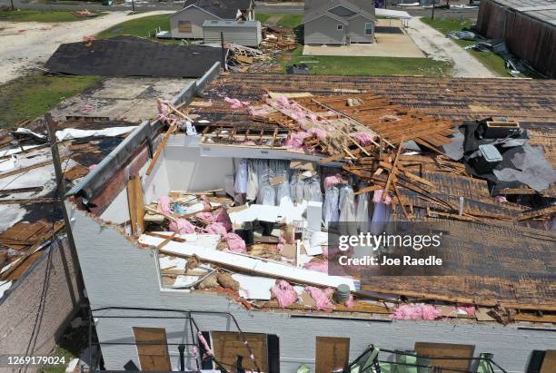 An aerial view from a drone shows clothing on racks of a businesses that's roof was ripped off as Hurricane Laura passed through the area on August...