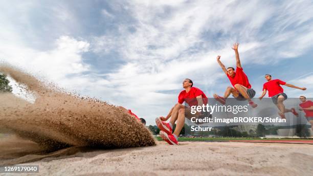 man, athletics, long jump series, germany - série séquentielle photos et images de collection