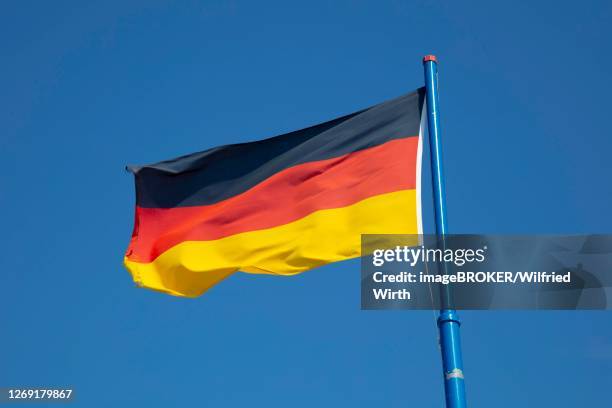 german flag in front of blue sky, lower saxony, germany - west germany 個照片及圖片檔