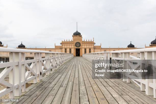 long wooden bridge to kallbadhuset varberg, cold bath house and sauna, moorish architectural style, varberg, halland, kattegat, sweden - varberg stock pictures, royalty-free photos & images