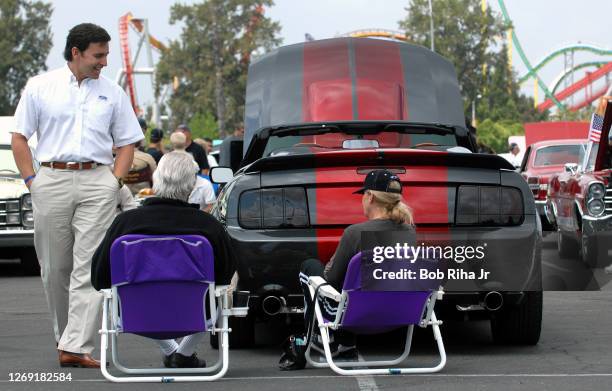 Mark Fields, North American chief for Ford Motor Company, talks with Ford Mustang owners during a tour at a car show at Knott's Berry Farm April 20,...