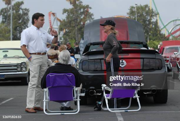 Mark Fields, North American chief for Ford Motor Company, talks with Ford Mustang owners during a tour at a car show at Knott's Berry Farm April 20,...