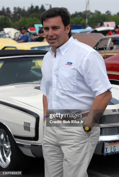 Mark Fields, North American chief for Ford Motor Company, talks with Ford Mustang owners during a tour at a car show at Knott's Berry Farm April 20,...