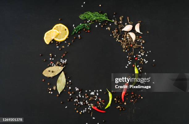 spices for cooking on black background - pepper seasoning stock pictures, royalty-free photos & images