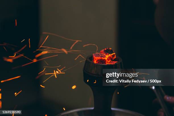 close-up of illuminated electric lamp at night - hookah stock pictures, royalty-free photos & images