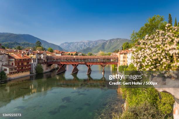 view of bridge over river against sky, bassano del grappa, italy - bassano del grappa stock pictures, royalty-free photos & images