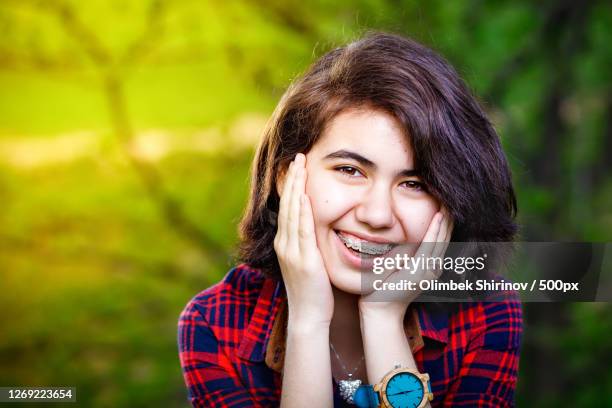 portrait of smiling young girl with hand on chin, dushanbe, tajikistan - dushanbe stock pictures, royalty-free photos & images