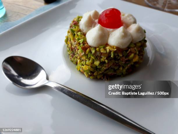 high angle view of dessert in plate on table, castelmola, italy - castelmola stock pictures, royalty-free photos & images