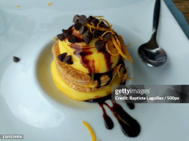 high angle view of dessert in plate on table, castelmola, italy - castelmola stock-fotos und bilder