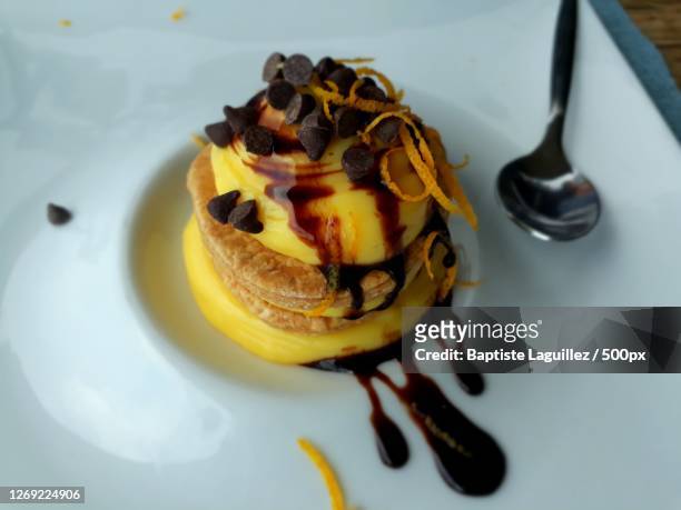 high angle view of dessert in plate on table, castelmola, italy - castelmola stock pictures, royalty-free photos & images