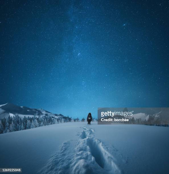 hiking under the starry sky - night stock pictures, royalty-free photos & images