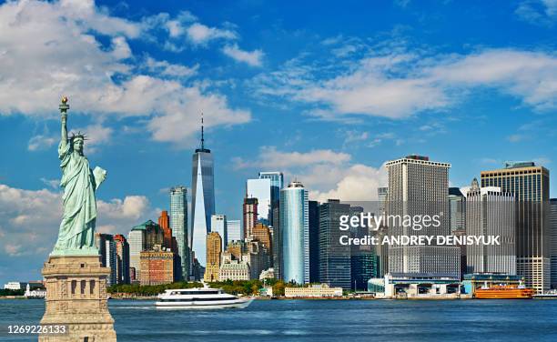 concept of new york city. statue of liberty. downtown - new york stockfoto's en -beelden