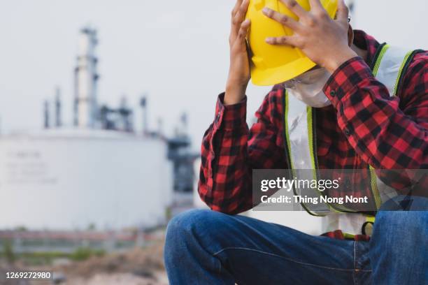 young engineer with job problems cumulative stress - construction mistake stock pictures, royalty-free photos & images