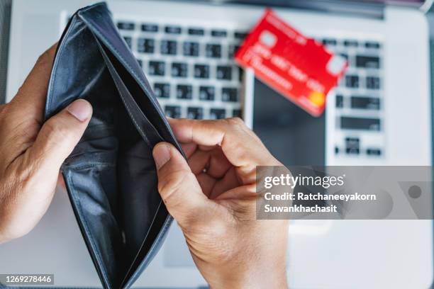 woman person holding an empty wallet. - pocket stock pictures, royalty-free photos & images