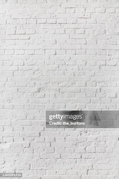 full frame shot of white painted brick wall, abstract background - muro di pietra foto e immagini stock